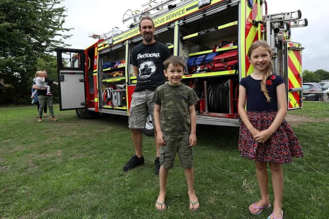 Ian Moore with Travis, six, and Amy, seven at Portchester Village Fete Picture: Chris Moorhouse