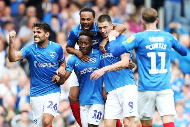 Pompey celebrate Jamal Lowe's first goal against Oxford. Picture: Joe Pepler