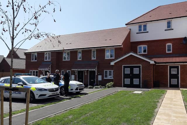 Police at the scene in Fareham where a man's body was found in his flat