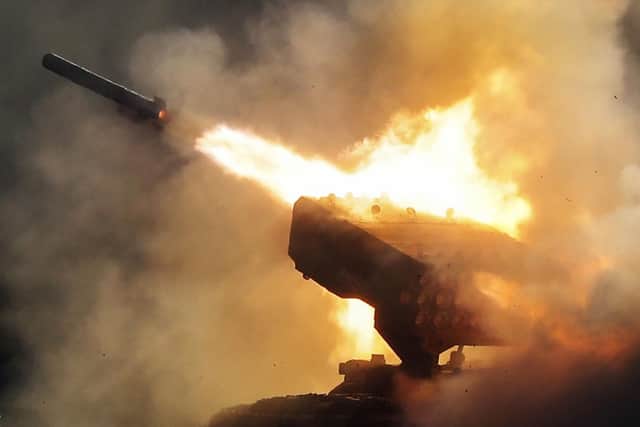 Russian heavy flamethrower system TOS-1 fires during the International Military Technical Forum Army-2018 in Alabino, outside Moscow, Tuesday, Aug. 21, 2018. Russia has displayed its latest weapons at a military show aimed at attracting more foreign customers. (AP Photo/Pavel Golovkin)