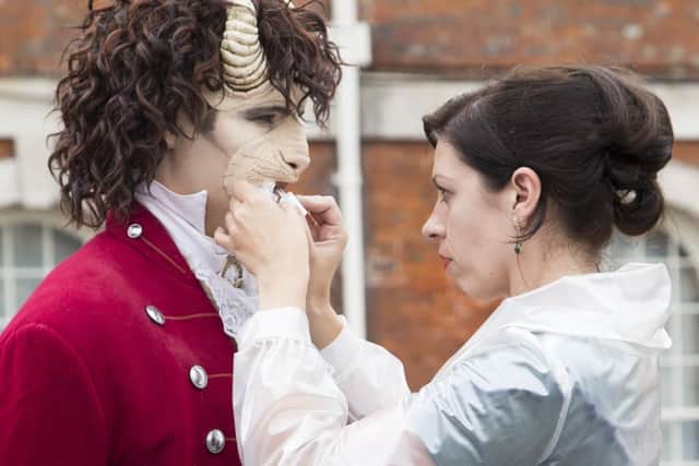 New Theatre Royals resident costume designer Naomi Gibbs working with The Beast at the press launch for the NTR's 2017 Christmas show, Beauty and The Beast.