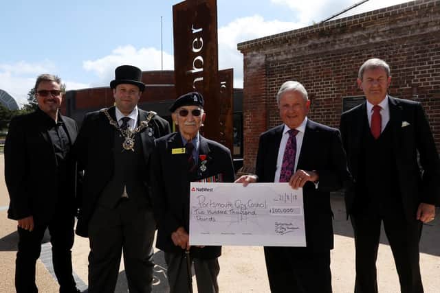 D-Day veteran John Jenkins receives a cheque on behalf of D-Day Story from the chairman of the Portsmouth D-Day Museum Trust, Roger Ching. Also pictured are fellow trustees of the museum Tim Rusby, left, Charles Ackroyd, right, and the Lord Mayor of Portsmouth, Cllr Lee Mason.