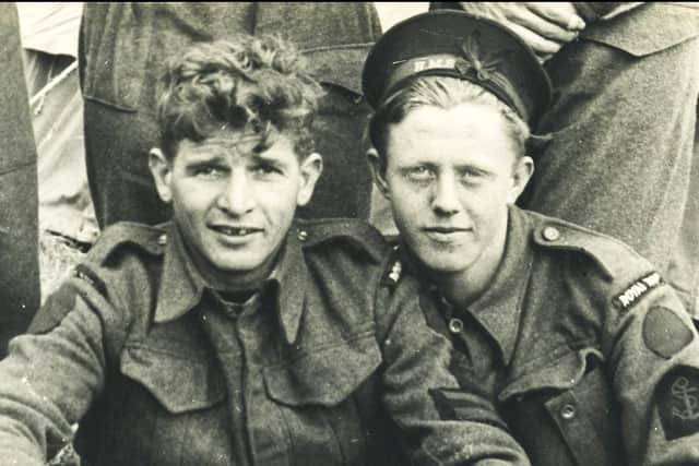 Petty officer Ronald McKinlay, pictured right