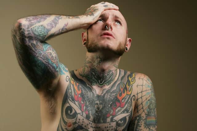 Chest and shoulder tattoos are among those most regretted in later life, along with tribal style art work and forearm ink. Photo posed by a model.