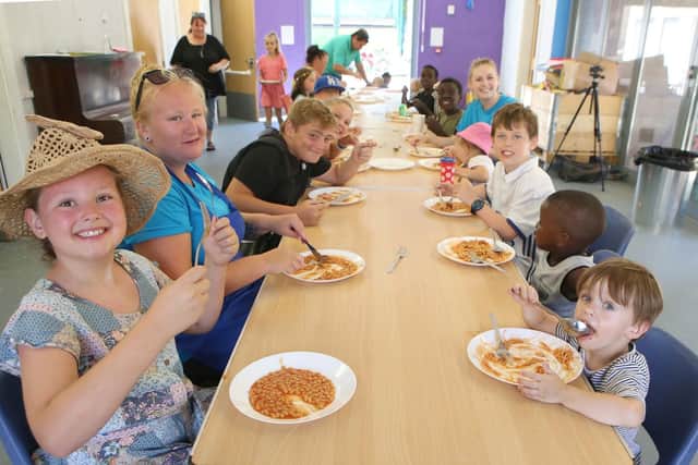 Children enjoy a healthy meal at Somers Town Adventure Playground
