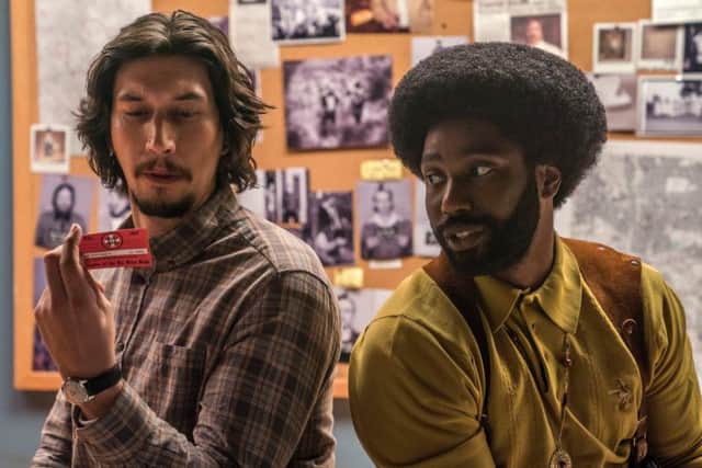 Adam Driver as Detective Flip Zimmerman and John David Washington as Detective Ron Stallworth.
