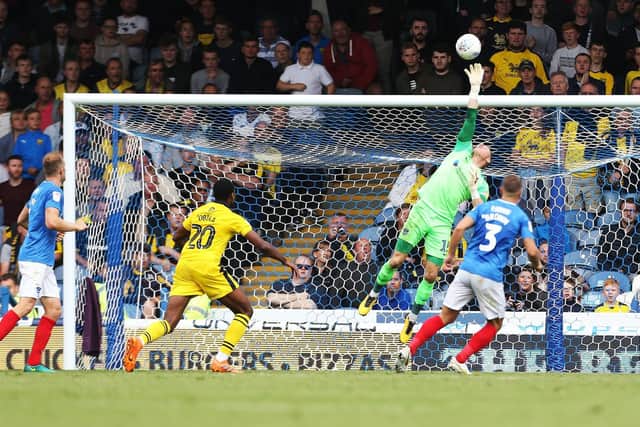 Craig MacGillivray pulls off a save against Oxford United.