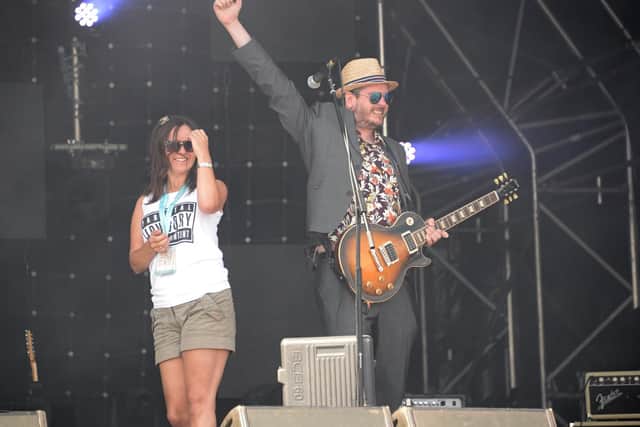 Jamie Kasper, frontman of Kill Kasper, celebrating a successful proposal on stage during the band's set at Victorious Festival, 2014