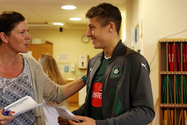Ollie Bridges is congratulated by principal Claudia Cubbage at Henry Cort Community College, Fareham Picture: Chris Moorhouse