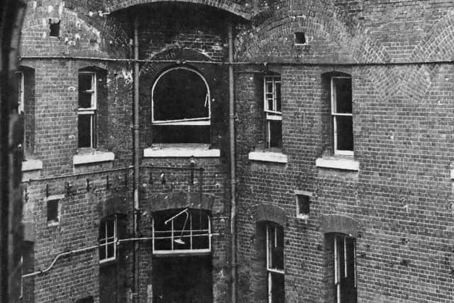 The courtyard, strewn with broken glass, bricks and other debris, was evidence that hooligans had been at work.