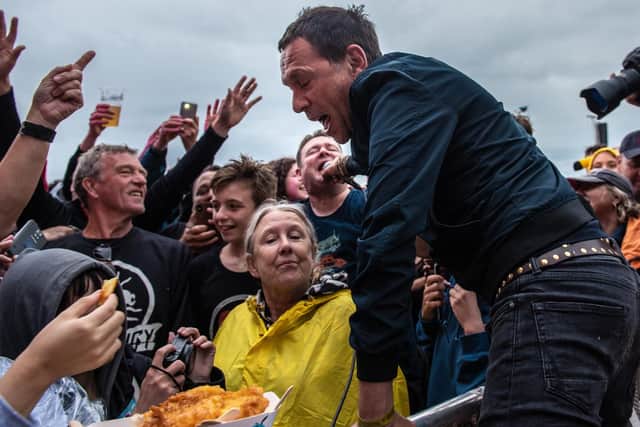 Shed Seven lead singer Rick Witter involves the crowds. Picture: Vernon Nash