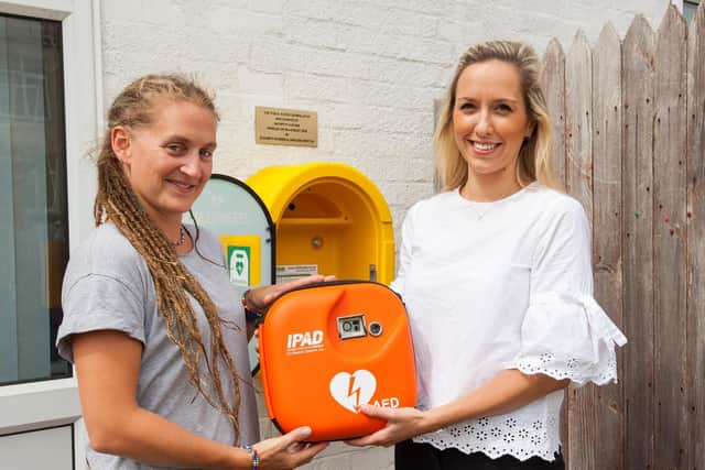 McCarthy and Stone donated and installed a defibrillator at Gorseway Nursery School on Hayling Island. Pictured is nursery owner Caroline Wrixton and the building firm's marketing executive Elizabeth Bowden. Picture: McCarthy and Stone