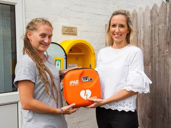 McCarthy and Stone donated and installed a defibrillator at Gorseway Nursery School on Hayling Island. Pictured is nursery owner Caroline Wrixton and the building firm's marketing executive Elizabeth Bowden. Picture: McCarthy and Stone