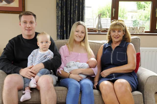 A song for Anorexia: Left to right, Liam Smith with baby Poppy Smith, Sophie Smith (23) with baby George Smith (19 days) and Caroline Skeet at her home in Langstone. Picture: Malcolm Wells