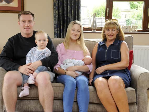 A song for Anorexia: Left to right, Liam Smith with baby Poppy Smith, Sophie Smith (23) with baby George Smith (19 days) and Caroline Skeet at her home in Langstone. Picture: Malcolm Wells