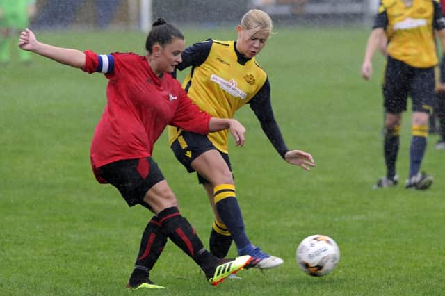 Action from the Women's FA Cup tie which was played in difficult conditions. Picture: Ian Hargreaves