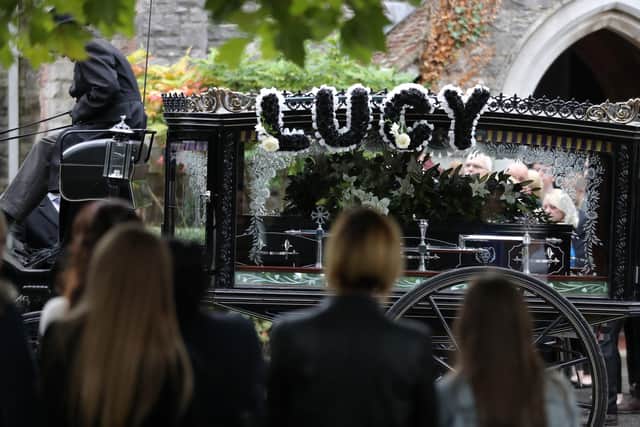 A horse-drawn hearse carrying the coffin of 13-year-old Lucy McHugh after her funeral ceremony at Hollybrook cemetery in Shirley, Southampton.