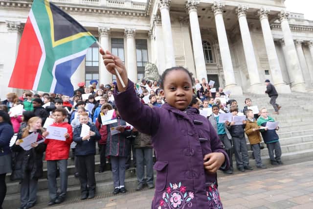 Karabo Tigedi, four, holding the South African flag. A choir, accompanied by schoolchildren from Portsmouth, sang a traditional South African song at Guildhall Square in 2017 to mark the centenary of the sinking of the SS Mendi during the First World War. The ship sank just off the Isle of Wight.
Picture: Habibur Rahman