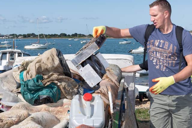 Alex Maggs adds a cooker to the pile
Picture: Keith Woodland
