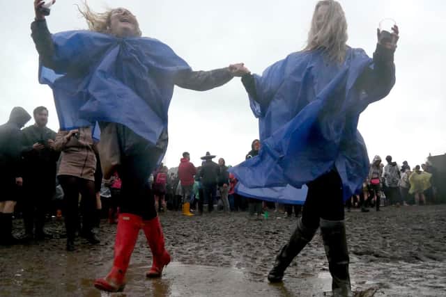 Amy Ashby and Beth Watson making a muddy splash. Picture: Habibur Rahman