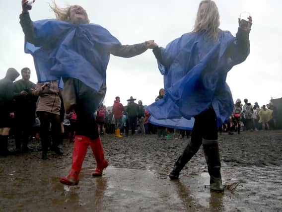 Amy Ashby and Beth Watson making a muddy splash. Picture: Habibur Rahman