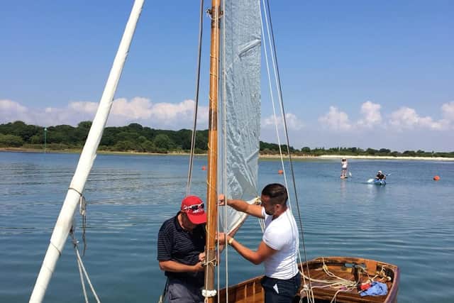 Joshua Smith and his father Paul Smith re-rigging Florence