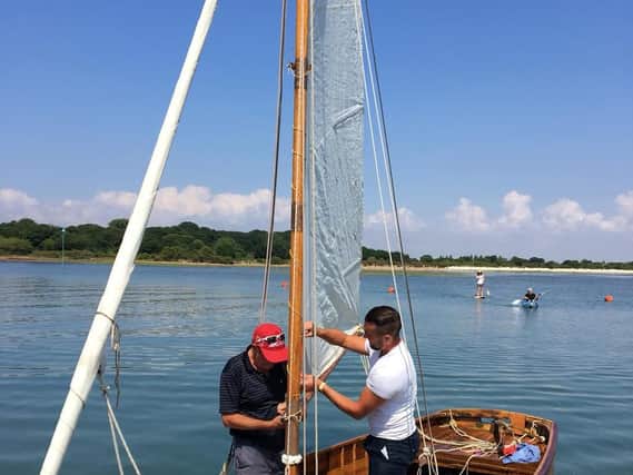 Joshua Smith and his father Paul Smith re-rigging Florence