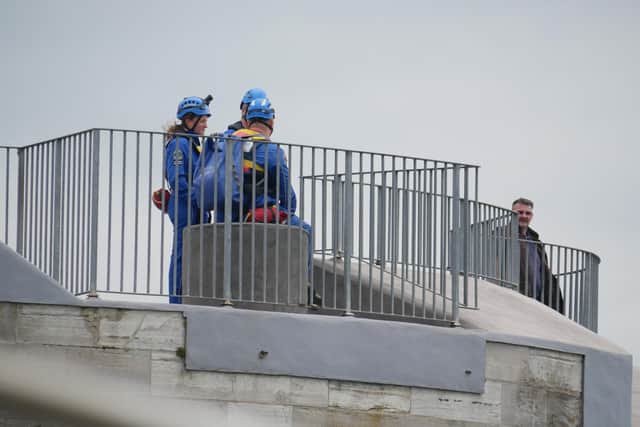 Coastguard rescuers stand on Round Tower in a bid to spot the man who is reported to have leapt from a passenger ferry shortly after 10.30am. Photo: Habibur Rahman