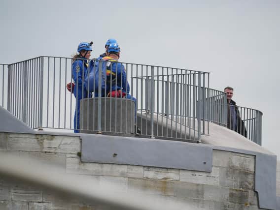 Coastguard rescuers stand on Round Tower in a bid to spot the man who is reported to have leapt from a passenger ferry shortly after 10.30am. Photo: Habibur Rahman