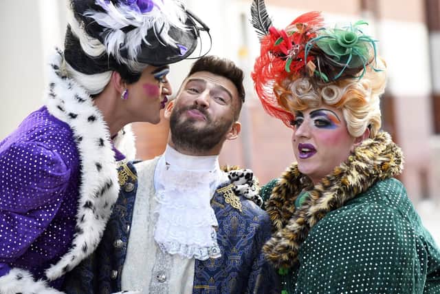 Kiss for a 'Prince', left to right Harry Howle as an 'Ugly Sister', Jake Quickenden as 'The Prince' and Paul Lawrence-Thomas as the other 'Ugly Sister' Picture by:  Malcolm Wells