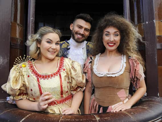 Jake Quickenden as ' The Prince', with (left) Natasha Barnes as 'Fairy Godmother' and (right) Kaya Rose as 'Cinderella' Picture: Malcolm Wells