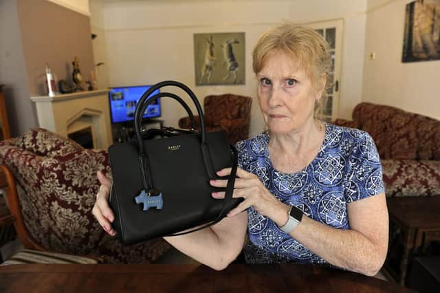 Ann Burgess from Fareham had been very upset with Tesco who previously refused to help her retrieve a purse which her daughter accidentally dropped between escalators at the company's Fareham store - but now it has been retrieved

Picture Ian Hargreaves