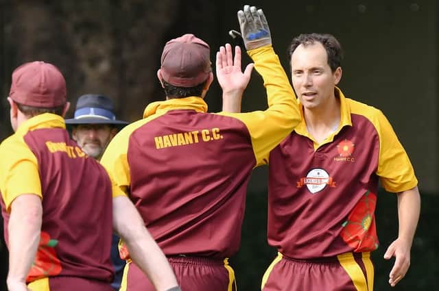 Richard Hindley, right, has become the first player to take 500 wickets in the Southern League premier division. Picture: Neil Marshall