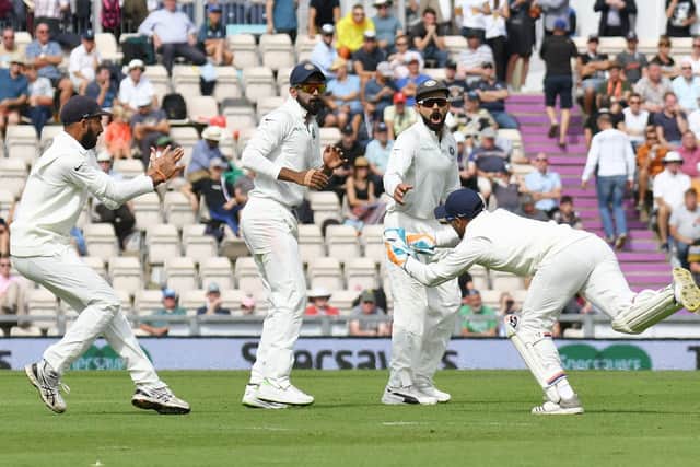 India wicketkeeper Rishabh Pant has his work cut out to cling on to a swinging delivery as the slip cordon look on. Picture: Neil Marshall