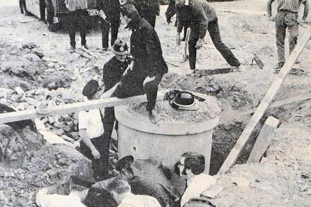 Men at work to rescue the man buried alive at Mile End.
