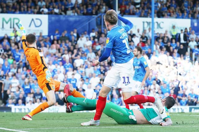 Ronan Curtis nets to seal Pompey's emphatic win. Picture: Joe Pepler