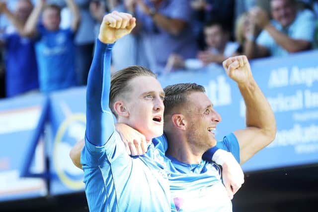 Ronan Curtis, left, and Lee Brown celebrate during another excellent win for Pompey. Picture: Joe Pepler