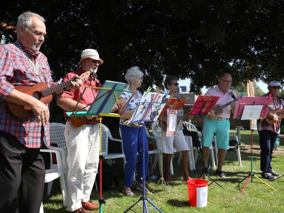 The Hayling Huggers play at a barbecue party for Emsworth carers in the garden next to the former cottage hospital, Emsworth  Picture: Chris Moorhouse