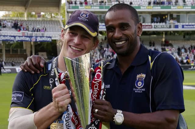 Man-of-the-match Jimmy Adams celebrates Clydesdale Bank 40 glory with former Hampshire team-mate Dimi Mascarenhas in 2012. Picture: Neil Marshall