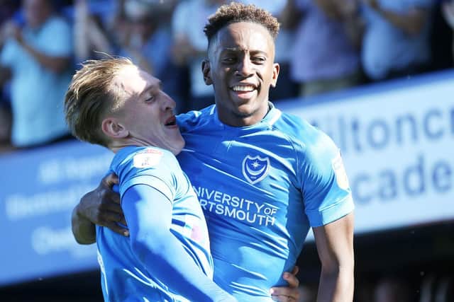 Ronan Curtis, left, and Jamal Lowe celebrate during Pompey's 3-0 victory over Plymouth. Picture: Joe Pepler