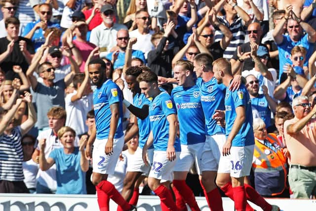 Pompey celebrate Ronan Curtis' opener during their 3-0 win over Plymouth. Picture: Joe Pepler