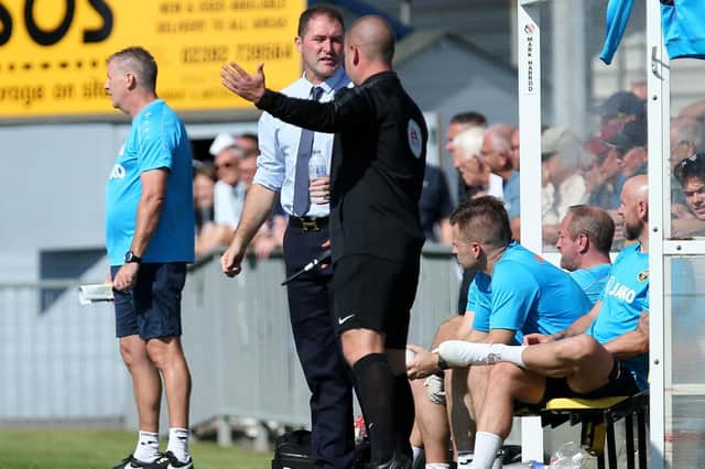 Hawks boss Lee Bradbury makes his feelings known to the fourth official. Picture: Chris Moorhouse