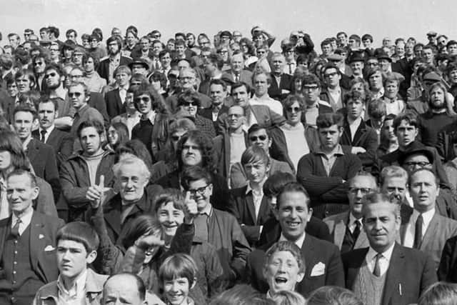 Part of the Milton End crowd at Fratton Park in the 1970s. Note the collars and ties.