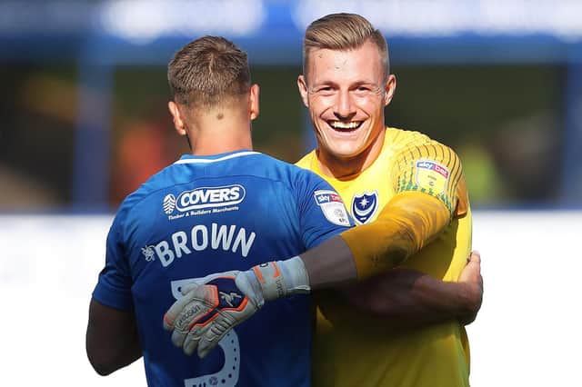 Craig MacGillivray celebrates Pompey's win over Plymouth with Lee Brown. Picture: Joe Pepler