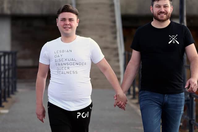 Business partners and couple Tom Pearson, right, and Tony Read at the launch of their Pride T-shirts, part of their PO1Realness brand, Hotwalls, Old Portsmouth. Picture: Chris Moorhouse