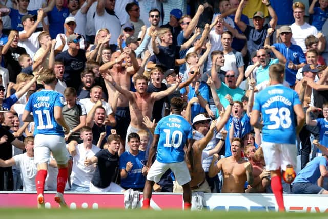 Jamal Lowe celebrates with Pompey fans after scoring against Luton. Picture: Joe Pepler