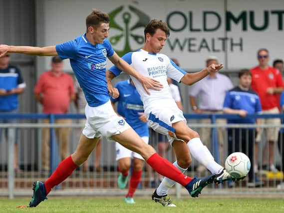 Matt Casey battles Alfie Rutherford for the ball during Pompey's pre-season friendly win against the Hawks. Picture: Neil Marshall