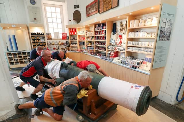 Workmen move a 42-pound cannon into position, which is the first artefact from the legendary HMS Victory 1744 wreck site to be shown to the public at The National Museum of the Royal Navy in Portsmouth Historic Dockyard. Picture: Andrew Matthews