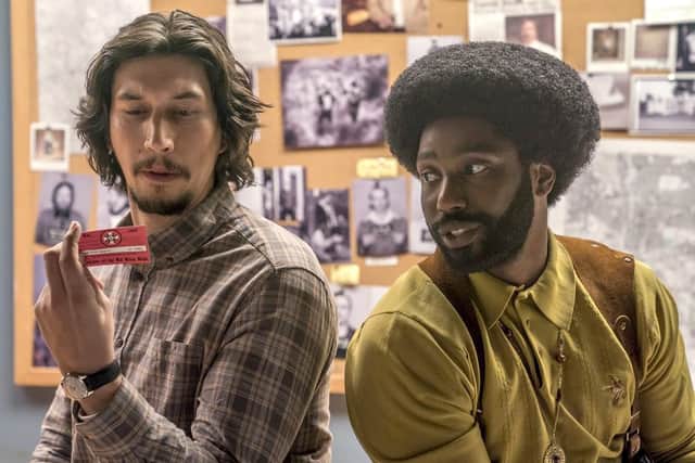 Adam Driver, left, and John David Washington, right, in BlacKKKlansman