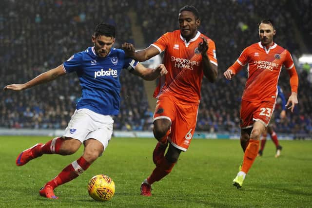 Omar Beckles put Greth Evans under pressure during Shrewsbury's trip to Pompey last season. Picture: Joe Pepler
